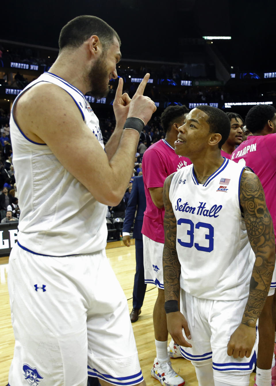 Seton Hall forward Sandro Mamukelashvili (23) celebrates wtih guard Shavar Reynolds (33) after hitting a basket in the final second of the team's NCAA college basketball game against Butler, Wednesday, Feb. 19, 2020, in Newark, N.J. Seton Hall won 74-72. (AP Photo/Kathy Willens)