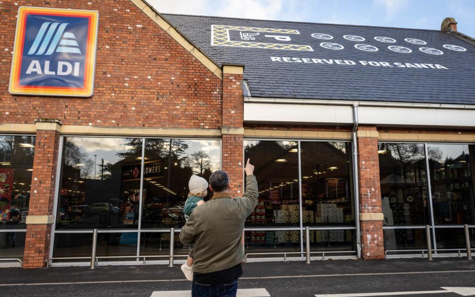 Aldi created a specially designated parking space for Santa's sleigh and his nine reindeers on the roof of its Knutsford store before Christmas