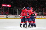 Washington Capitals players celebrate after a goal by Evgeny Kuznetsov during the third period of an NHL hockey game against the New York Rangers, Saturday, Feb. 25, 2023, in Washington. The Capitals won 6-3. (AP Photo/Julio Cortez)