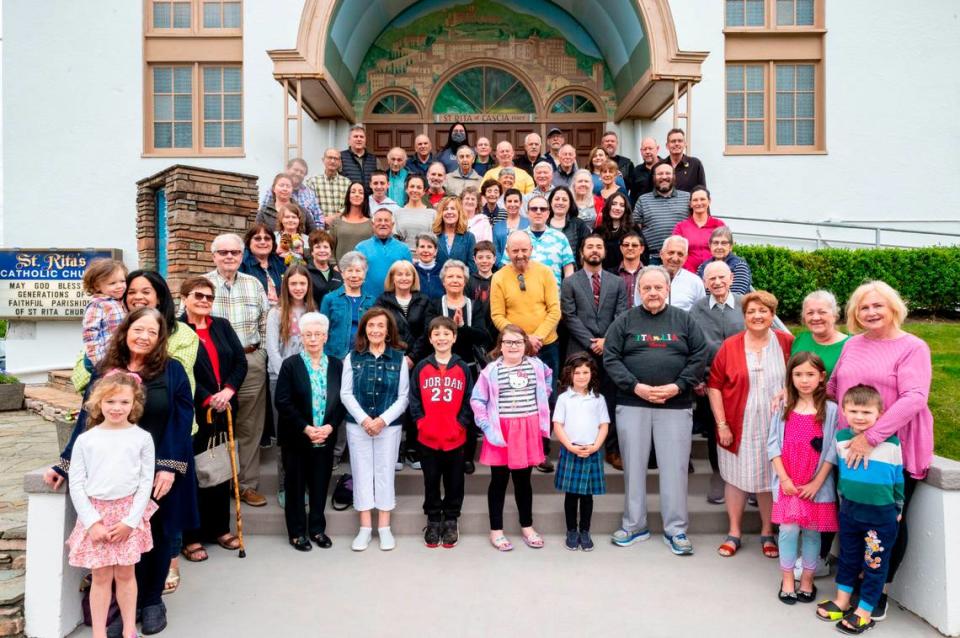 Parishioners of St. Rita of Cascia gather together for a group portrait on Tuesday, June 14, 2022, outside the church in Tacoma.
