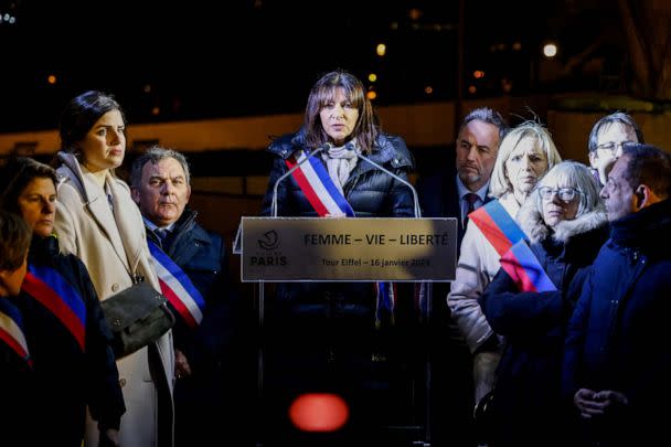PHOTO: Paris Mayor Anne Hidalgo delivers a speech on the Trocadero Esplanade during an event to display the slogan 'Woman. Life. Freedom.' on the Eiffel Tower, in a show of support to the Iranian people, in Paris, on Jan. 16, 2023. (Ludovic Marin/AFP via Getty Images)