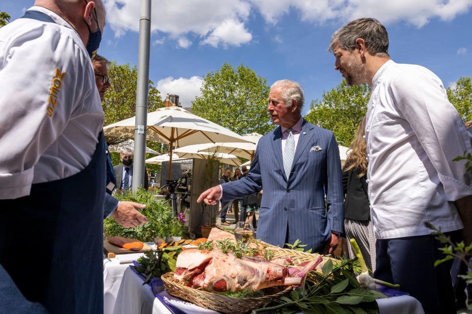 Britain's Prince Charles, Prince of Wales and Britain's Camilla, Duchess of Cornwall meet local suppliers, M. Moen & Sons Butchers during their visit to Clapham Old Town, south London on May 27, 2021. (Photo by Heathcliff O'Malley / POOL / AFP) (Photo by HEATHCLIFF O'MALLEY/POOL/AFP via Getty Images)