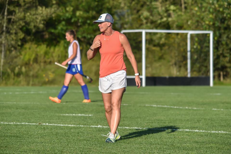 Colchester Coach Shawn Lefebvre watches over her team's warm up as the Lakers take on the Mount Mansfield Cougars earlier this season in Jericho. Her Lakers came out on top 2-1.