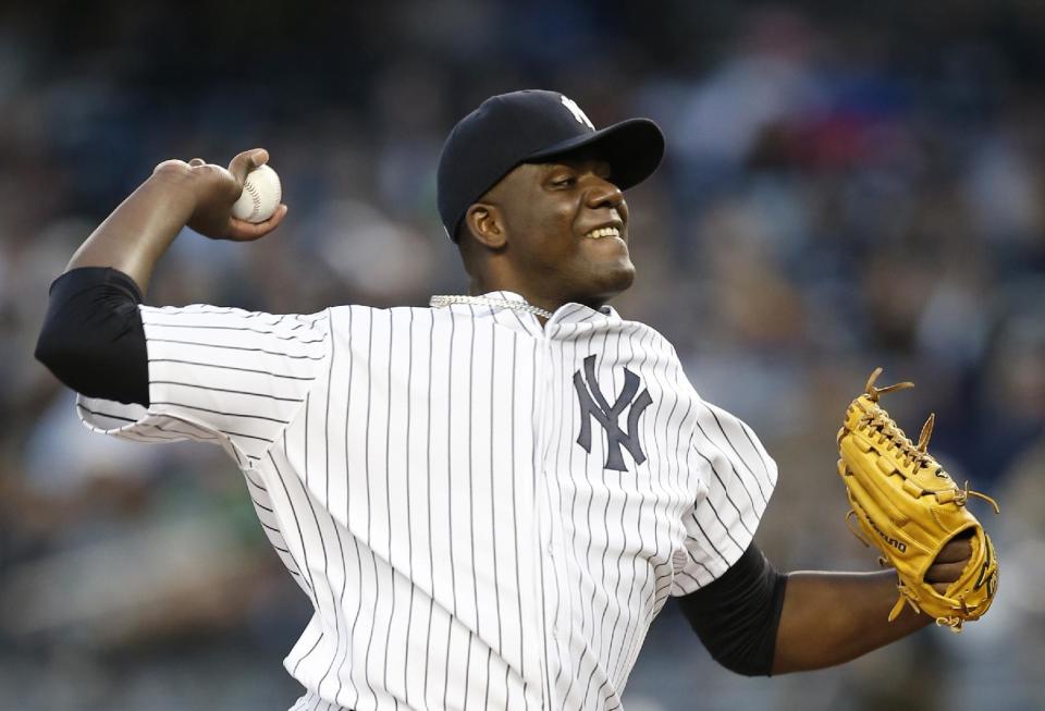 New York Yankees starting pitcher Michael Pineda delivers in the first inning of a baseball game against the Boston Red Sox at Yankee Stadium in New York, Thursday, April 10, 2014. (AP Photo/Kathy Willens)