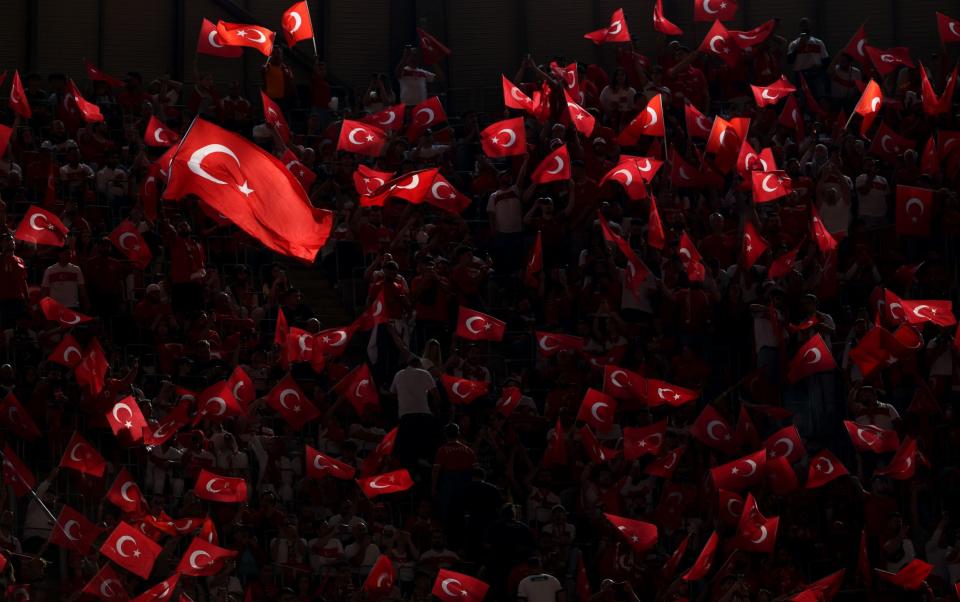 Turkish fans wait for the UEFA EURO 2024 group F soccer match between Turkey and Portugal