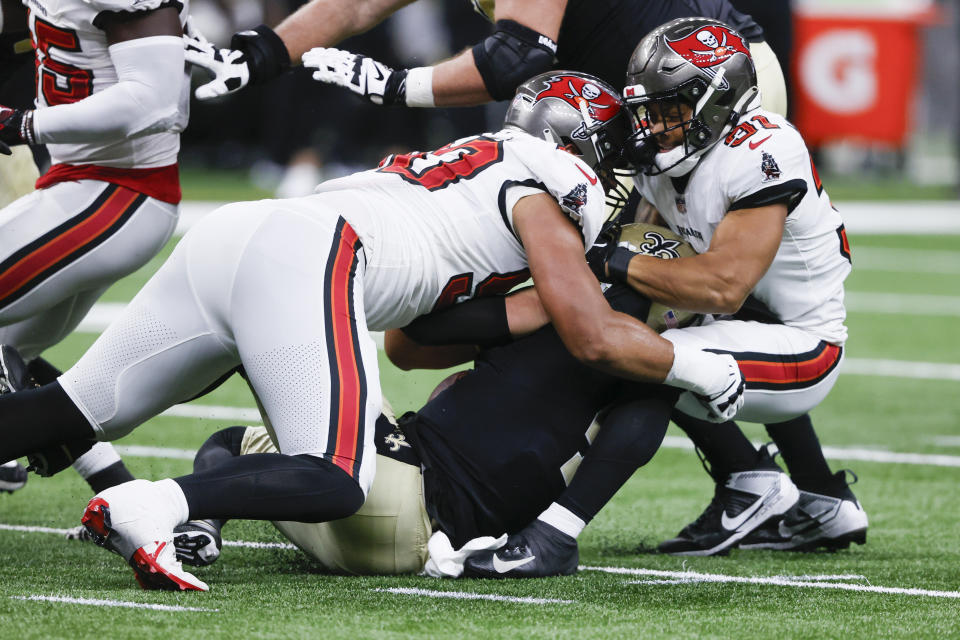 Tampa Bay Buccaneers safety Antoine Winfield Jr., right, and defensive end Logan Hall, sack New Orleans Saints quarterback Derek Carr in the first half of an NFL football game in New Orleans, Sunday, Oct. 1, 2023. (AP Photo/Butch Dill)