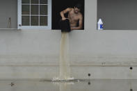 <p>A resident bails water from a flooded home in the aftermath of Hurricane Maria, in Catano, Puerto Rico, Wednesday, Sept. 27, 2017. (Photo: Carlos Giusti/AP) </p>