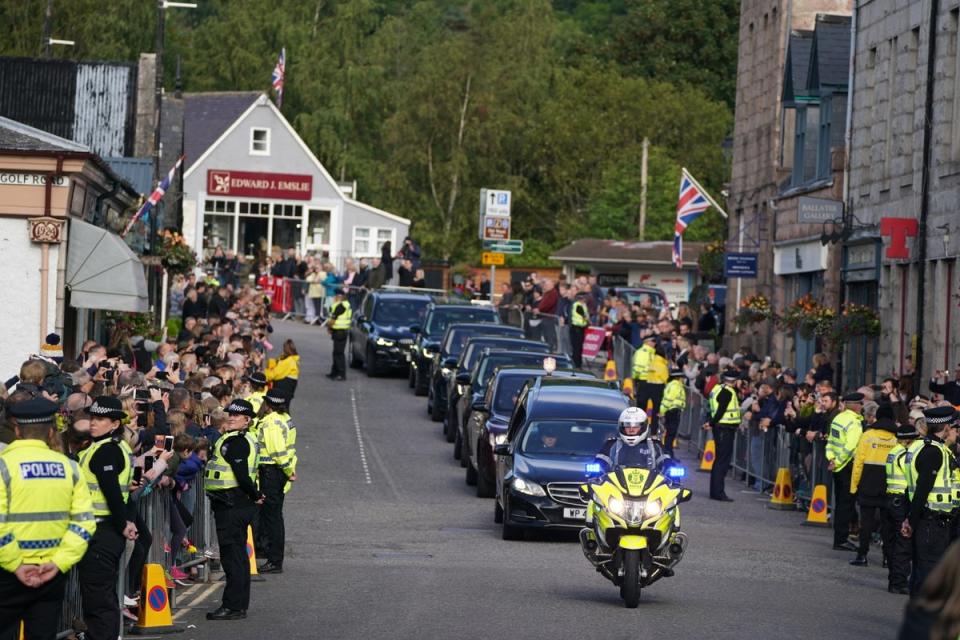 The procession passing through Ballater (PA Wire)