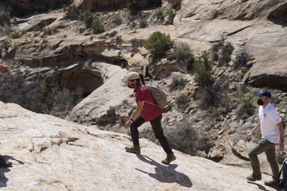 U.S. Interior Secretary Deb Haaland tours near ancient dwellings along the Butler Wash trail during a visit to Bears Ears National Monument Thursday, April 8, 2021, near Blanding, Utah. (AP Photo/Rick Bowmer, Pool)