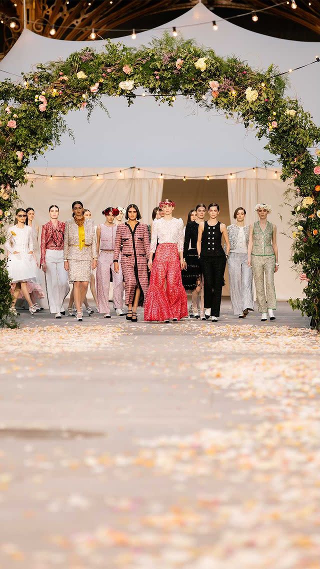<p>Creative Director Virginie Viard recreated a summer village wedding in the Grand Palais for the SS21 Couture show. With Penélope Cruz, Marion Cotillard and Lily-Rose Depp as esteemed guests.</p><p>'I knew we couldn't organise a big show, that we would have to invent something else, so I came up with the idea of a small cortege that would come down the stairs of the Grand Palais and pass beneath arches of flowers. Like a family celebration, a wedding.' Viard said.</p><p>The simple, but no less moving set, feels somewhat fantastical in a year where <a href="https://www.elle.com/uk/fashion/celebrity-style/g30864/wedding-dress-inspiration-haute-couture-fashion-week/" rel="nofollow noopener" target="_blank" data-ylk="slk:weddings are limited;elm:context_link;itc:0;sec:content-canvas" class="link ">weddings are limited</a>, bringing hope to <a href="https://www.elle.com/uk/haute-couture-fashion-week/" rel="nofollow noopener" target="_blank" data-ylk="slk:Haute Couture fashion week;elm:context_link;itc:0;sec:content-canvas" class="link ">Haute Couture fashion week</a>. </p><p><a href="https://www.instagram.com/p/CKgjlq0ovZK/" rel="nofollow noopener" target="_blank" data-ylk="slk:See the original post on Instagram;elm:context_link;itc:0;sec:content-canvas" class="link ">See the original post on Instagram</a></p>