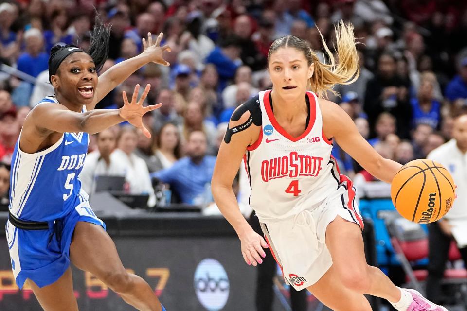 Mar 24, 2024; Columbus, OH, USA; Ohio State Buckeyes guard Jacy Sheldon (4) dribbles past Duke Blue Devils guard Oluchi Okananwa (5) during the second half of the women’s NCAA Tournament second round at Value City Arena. Ohio State lost 75-63.