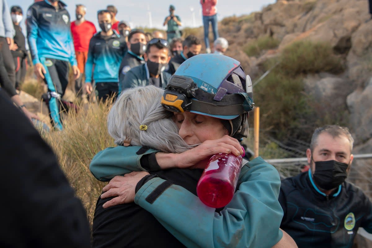 Spanish sportswoman Beatriz Flamini (R) hugs a relative upon getting out of a cave in Los Gauchos, near Motril on April 14, 2023 after spending 500 days inside (AFP via Getty Images)