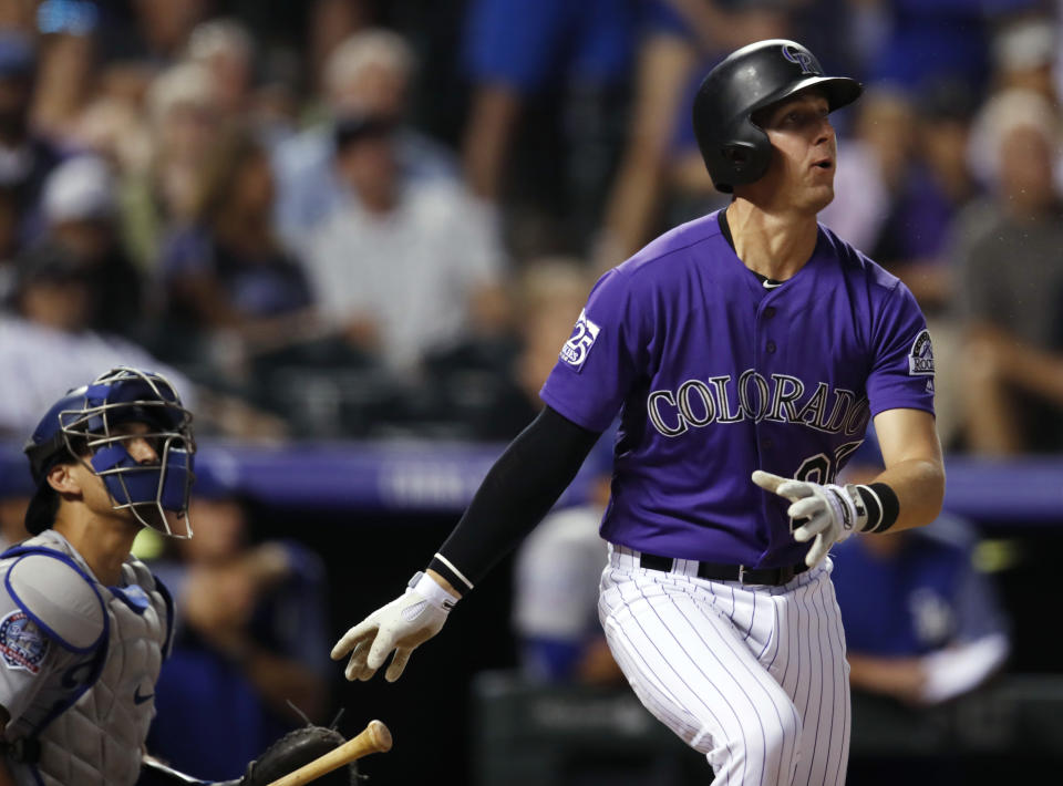 Colorado Rockies' Ryan McMahon watches his three-run, walk-off home run off Los Angeles Dodgers relief pitcher JT Chargois during a baseball game Saturday, Aug. 11, 2018, in Denver. The Rockies won 3-2. (AP Photo/David Zalubowski)