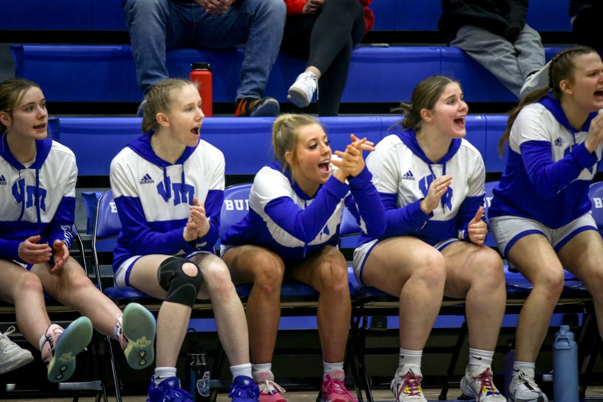 Van Meter's bench cheers on in the third quarter against Roland-Story on Monday, Feb. 5, 2024.