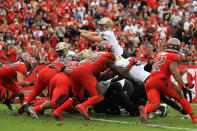 <p>Drew Brees #9 of the New Orleans Saints scores a touchdown during the fourth quarter against the Tampa Bay Buccaneers at Raymond James Stadium on December 09, 2018 in Tampa, Florida. (Photo by Mike Ehrmann/Getty Images) </p>