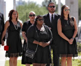 <p>Children of Sen. John McCain, R-Ariz., from back left Sidney McCain, Meghan McCain and her husband Ben Domenech, Bridgett McCain, front center and daughter-n-law Holly McCain, follow behind the casket into the Capitol rotunda for a memorial service, Wednesday, Aug. 29, 2018, at the Capitol in Phoenix. (Photo: Matt York/AP) </p>
