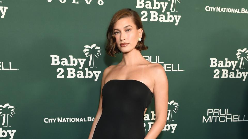 Hailey Bieber wearing a strapless gown by Saint Laurent 