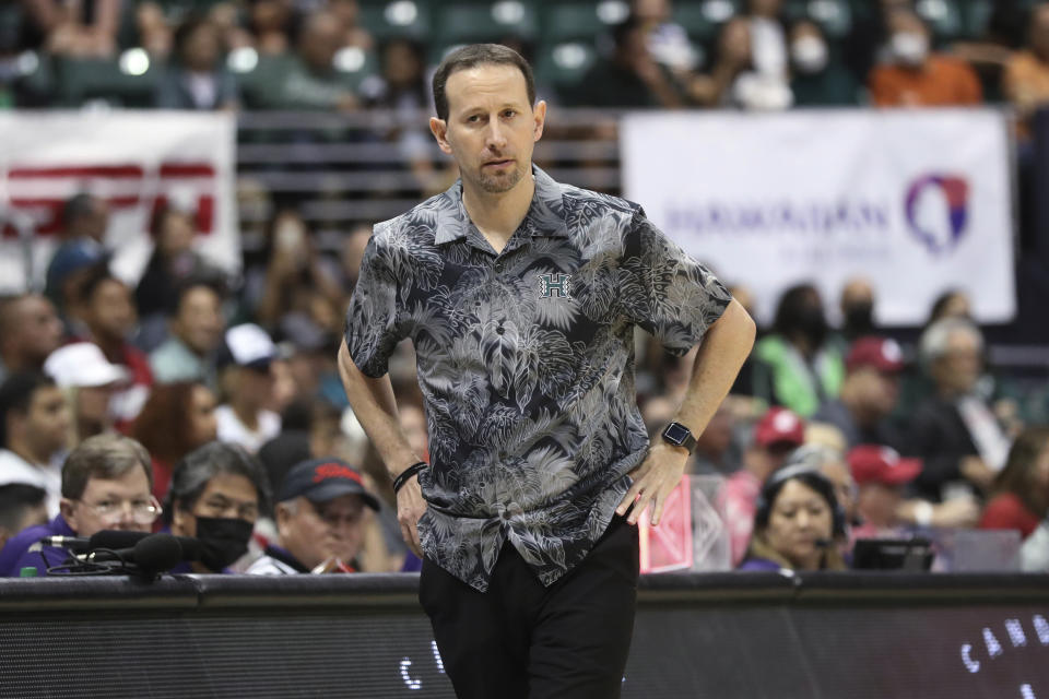 Hawaii coach Eran Ganot watches during the first half of the team's NCAA college basketball game against Washington State, Friday, Dec. 23, 2022, in Honolulu. (AP Photo/Marco Garcia)
