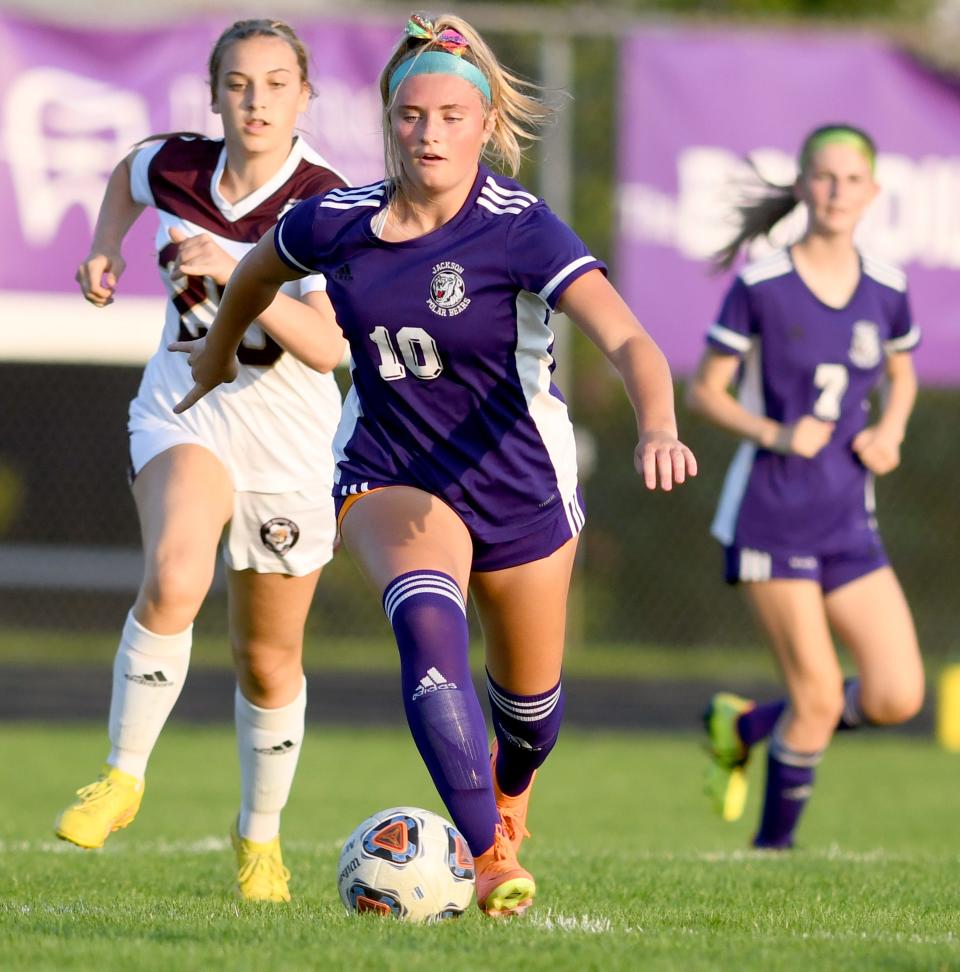 Jackson's Harper Wood moves the ball during Thursday's match against Stow.