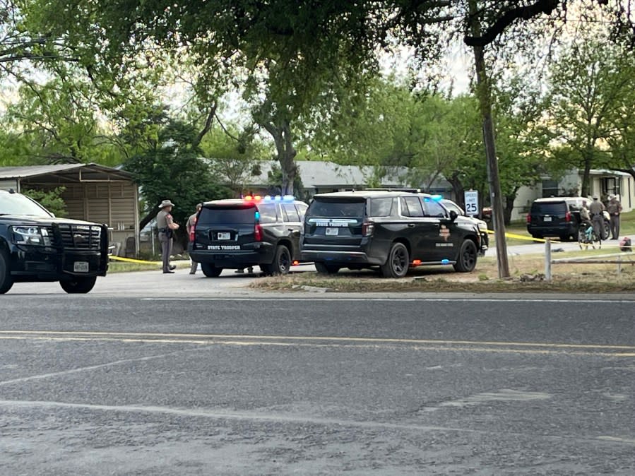 Texas DPS troopers on the scene in Mertzon. Crime scene tape blocks off a residential area as law enforcement continues their investigation.