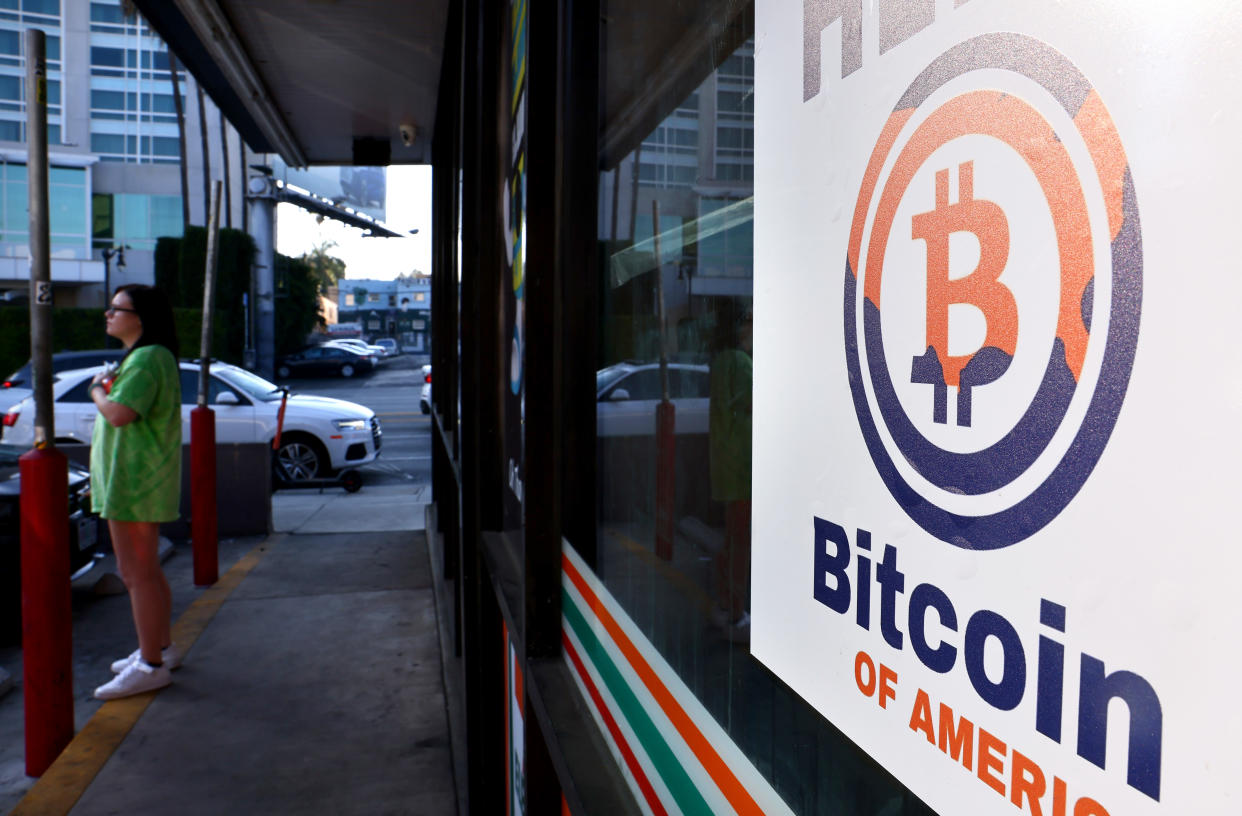 A sign advertising a Bitcoin ATM is posted at a 7-Eleven store on November 10, 2021 in Los Angeles, California. The price of the cryptocurrency hit a new record high today nearly breaking through $69,000 as inflation has risen to a level not seen in 30 years. (Photo by Mario Tama/Getty Images)