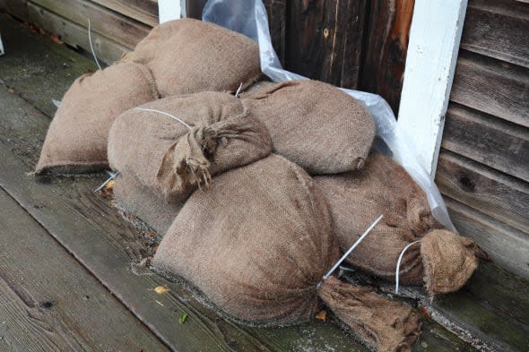 Flood Control, Sandbags. Sandbags stacked in a doorway to prevent flooding.