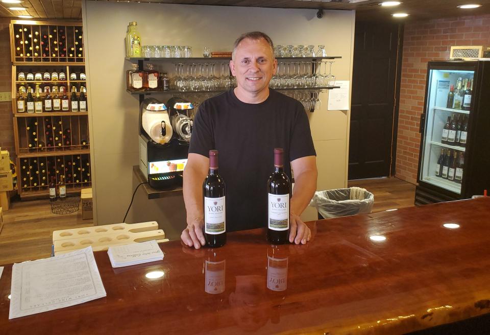 Michael Yori, 52, owner of Michael's Pizzeria and Yori Wine Cellars, stands, on July 21, 2021, behind the new bar at his business at 20 S. Lake St. in North East. Yori, who opened the pizza shop in 1987 and the winery in 2017, says there's a business "boom" downtown, which includes his decision to renovate and expand.