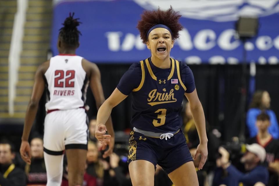 Notre Dame's Hannah Hidalgo (3) celebrates after making a 3-point basket against NC State during the first half of an NCAA basketball game for the Women's Atlantic Coast Conference championship in Greensboro, N.C., Sunday, March 10, 2024. (AP Photo/Chuck Burton)