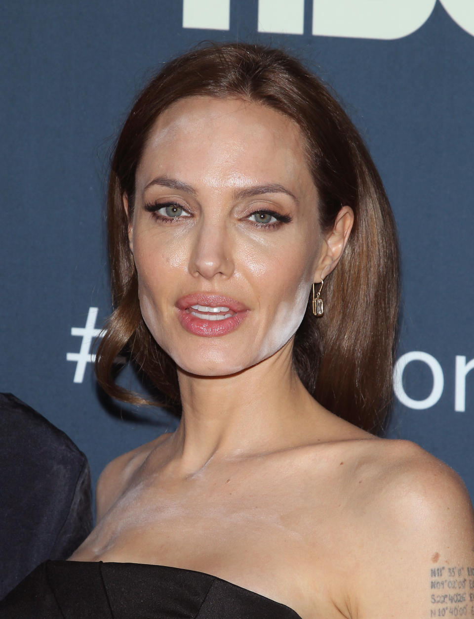 Angelina Jolie with white powder all over her face