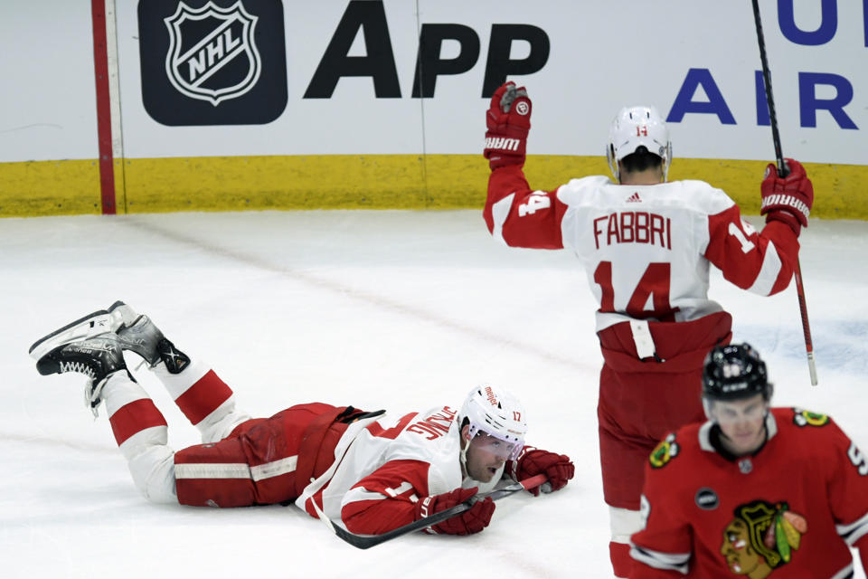 Detroit Red Wings' Daniel Sprong (17) celebrates with teammate Robby Fabbri (14) after scoring during the first period of an NHL hockey game against the Chicago Blackhawks, Sunday, Feb. 25, 2024, in Chicago. (AP Photo/Paul Beaty)