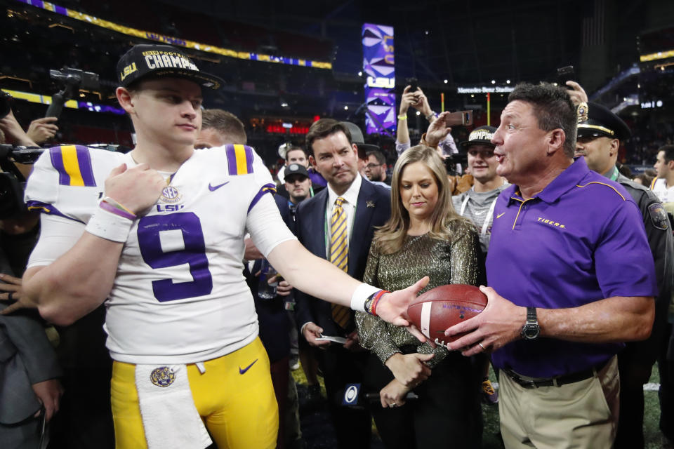 LSU quarterback Joe Burrow and LSU head coach Ed Orgeron celebrate after the SEC championship on Dec. 7. (AP)