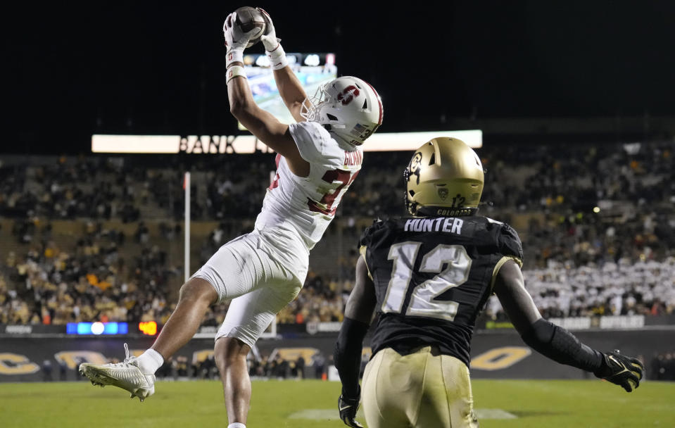 Stanford safety Alaka'i Gilman, left, intercepts a pass intended for Colorado wide receiver Travis Hunter in the end zone in overtime of an NCAA college football game early Saturday, Oct. 14, 2023, in Boulder, Colo. (AP Photo/David Zalubowski)