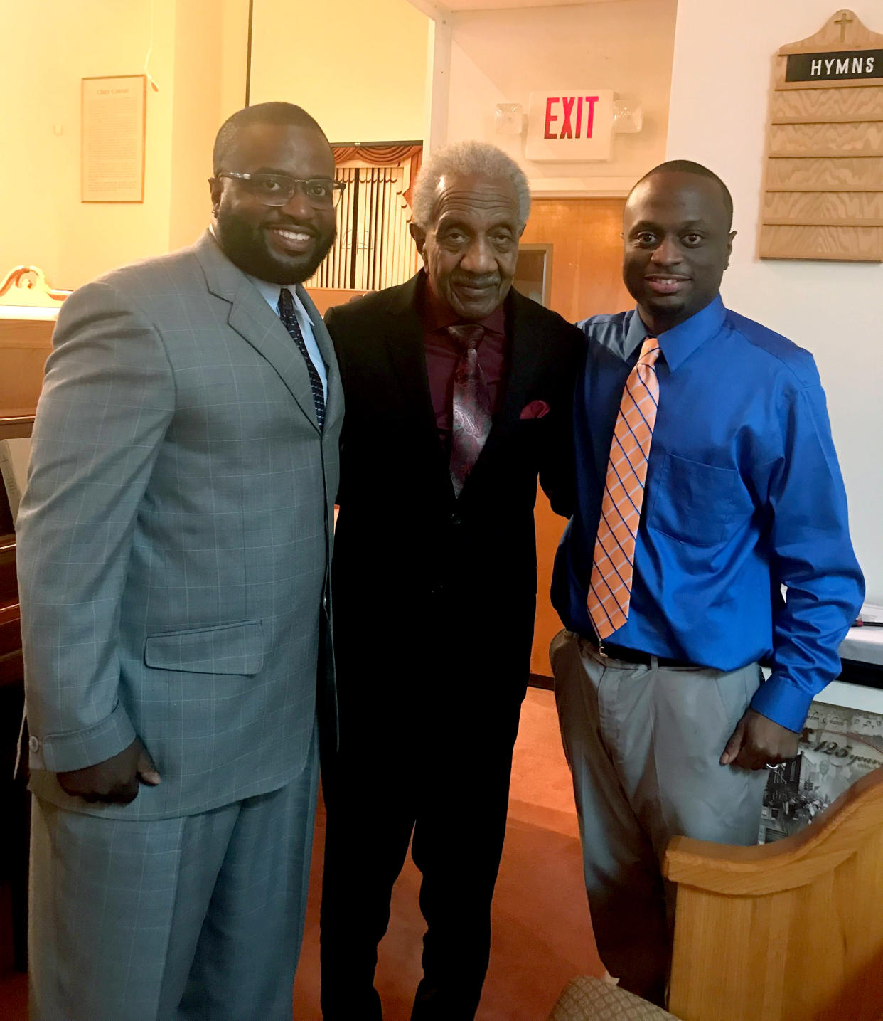 Alan Reese, left, and Marvin Reese with their grandfather F.D. Reese, center, in church. (Family photo)