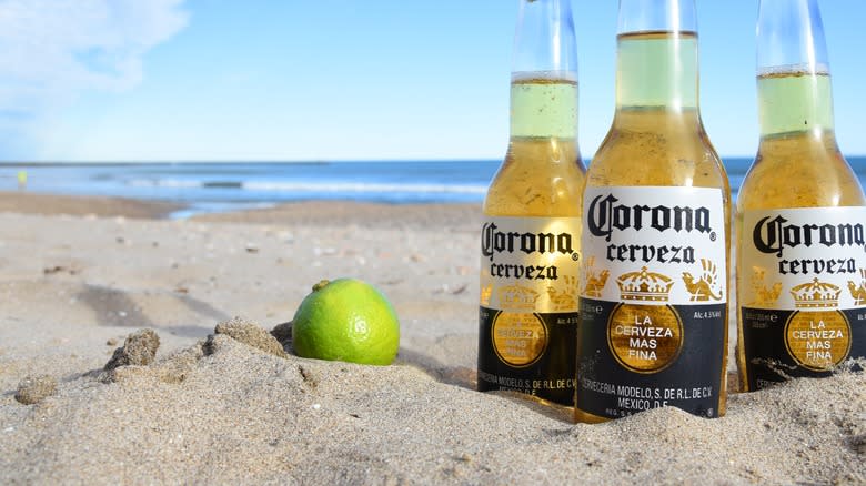 Corona bottles in the sand