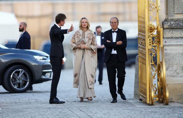 Xavier Niel and Delphine Arnault in stands during French Tennis