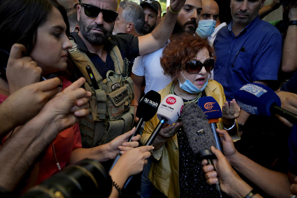 Lebanese Judge Ghada Aoun speaks to the press after raiding the Central Bank with security forces to pursue Central Bank Governor Riad Salameh, who she has charged with corruption in Beirut, Lebanon, Tuesday, July 19, 2022. (AP Photo/Bilal Hussein)