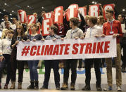 Polish teenagers stage a protest in the U.N. climate conference venue on the last days of talks to urge negotiators from almost 200 countries to reach an agreement on ways of keeping global warming in check in Katowice, Poland, Friday, Dec. 14, 2018.(AP Photo/Czarek Sokolowski)