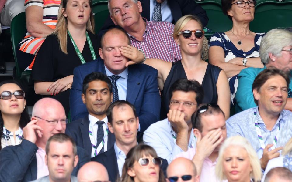 Zara covers her husband's eyes while watching a tennis match at Wimbledon - Credit: Karwai Tang