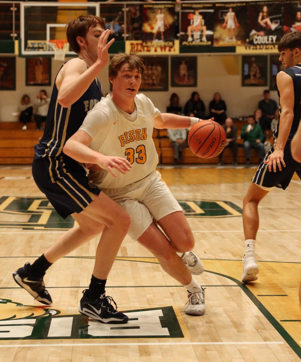 Benton Central's Hunter Sisson drives into the paint in the first half against Fountain Central.