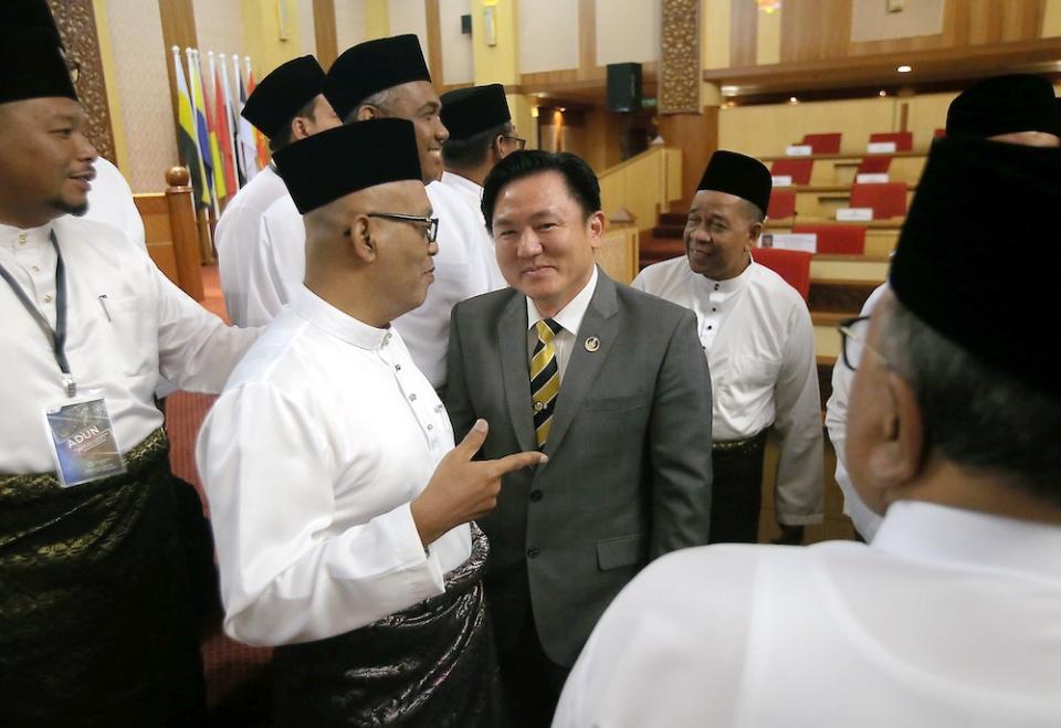 Perak DAP assemblyman Paul Yong banters with Opposition assemblymen at the State Legislative Assembly in the State Secretariat Building in Ipoh November 15, 2019. — Picture by Farhan Najib