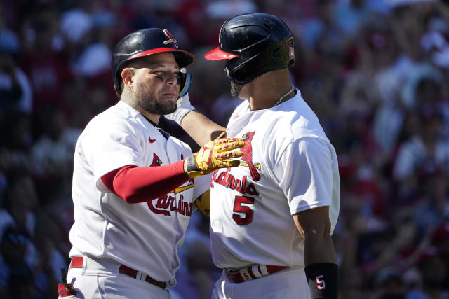 Albert Pujols and Yadier Molina hug at home