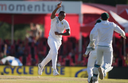 Cricket - India v South Africa - Second Test match - Centurion Stadium, Pretoria, South Africa - January 16, 2018. South Africa’s Lungi Ngidi celebrates taking the wicket of India’s Virat Kohli. REUTERS/James Oatway