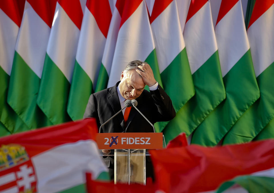 FILE - In this Friday, April 6, 2018, file photo, Prime Minister Viktor Orban's pauses while delivering a speech during the final electoral rally of his Fidesz party in Szekesfehervar, Hungary. As the Hungarian prime minister’s conflicts with the European Union appear headed to a breaking point, calls are increasing for greater scrutiny of his government’s spending of EU funds. An opposition lawmaker in Hungary has gathered over 470,000 signatures to pressure Prime Minister Viktor Orban into joining the budding European Public Prosecutor’s Office as Orban’s Fidesz party may be suspended or expelled next week from the main center-right group in the European Parliament, it was announced Thursday, March 14, 2019(AP Photo/Darko Vojinovic, File)