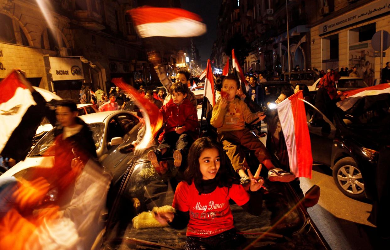 <p>Egyptians celebrate after the announcement of President Hosni Mubarak’s resignation in February 2011</p> (REUTERS)