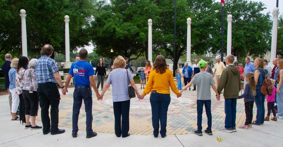 Supporters of Citizens Defending Freedom gather Monday morning at Fort Blount Park in downtown Bartow. The group filed a lawsuit Monday morning, accusing the Polk County School Board of violating state law in his procedures for handling challenges to books in school libraries.