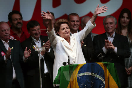 Brazil's President and Workers' Party (PT) presidential candidate Dilma Rousseff celebrates during a news conference after disclosure of the election results, in Brasilia October 26, 2014. REUTERS/Ueslei Marcelino