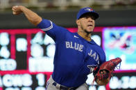 Toronto Blue Jays pitcher Jose Berrios throws against his former team, the Minnesota Twins, in the first inning of a baseball game, Friday, Sept. 24, 2021, in Minneapolis. (AP Photo/Jim Mone)