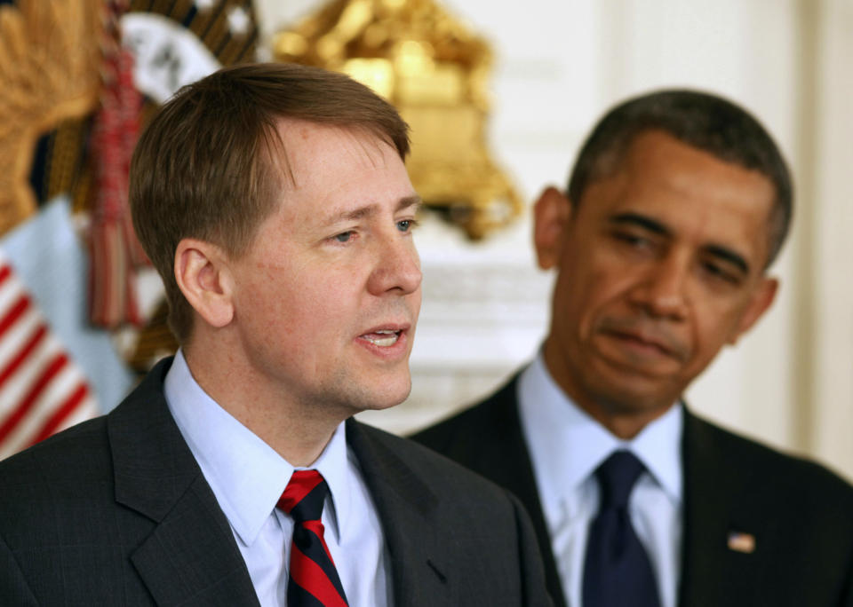 U.S. President Barack Obama (R) stands next to Richard Cordray after Obama announced Cordray's renomination to lead the Consumer Financial Protection Bureau in the State Dining Room of the White House in Washington, January 24, 2013.  REUTERS/Larry Downing  (UNITED STATES - Tags: POLITICS BUSINESS)