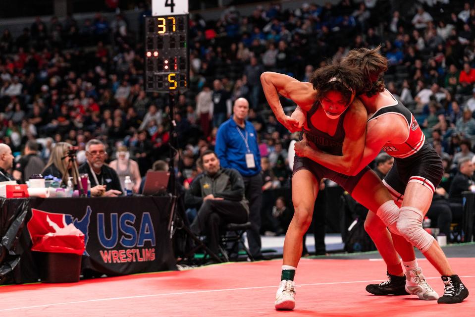 Windsor's Santi Fernandez avoids a takedown by Montrose's Quinn Brown in a 5th-place match during the Colorado state wrestling tournament at Ball Arena on Saturday, Feb. 18, 2023 in Denver, Colo.