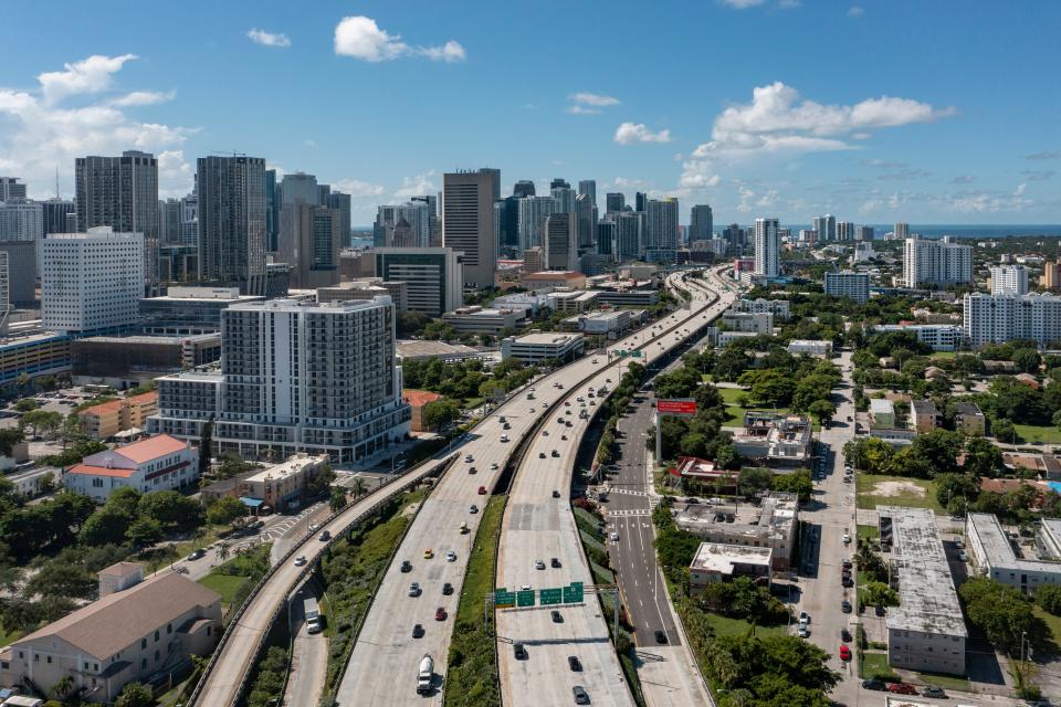 Interstate 95 runs through Miami's Overtown, right and bottom left, on August 9, 2021 in Miami, Florida. The enclave was decimated in the 1950s and 1960s by construction of Interstate-95, the Dolphin Expressway and the Midtown Interchange.